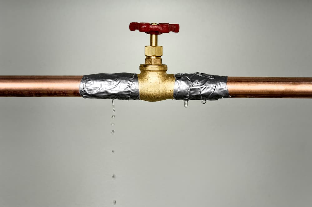closeup-shot-of-the-leaking-water-pipe-with-red-va-2025-02-09-18-12-45-utc (1)